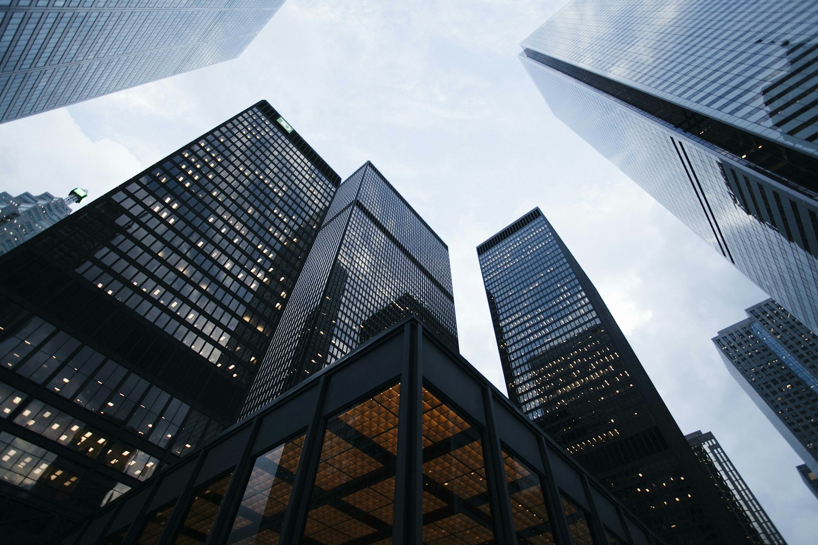 Modern high-rise glass facade at golden hour — PropTech hiring.