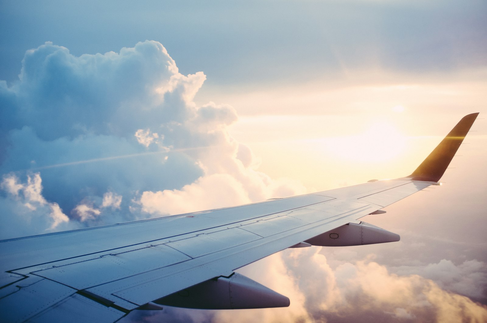Wide-body aircraft on tarmac at soft dawn — aviation hiring.
